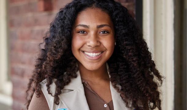 gold award girl scout smiling